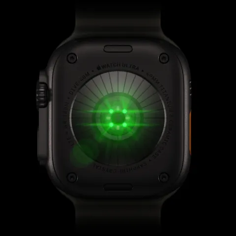The back of Apple Watch Ultra 4, its heart sensors glowing green